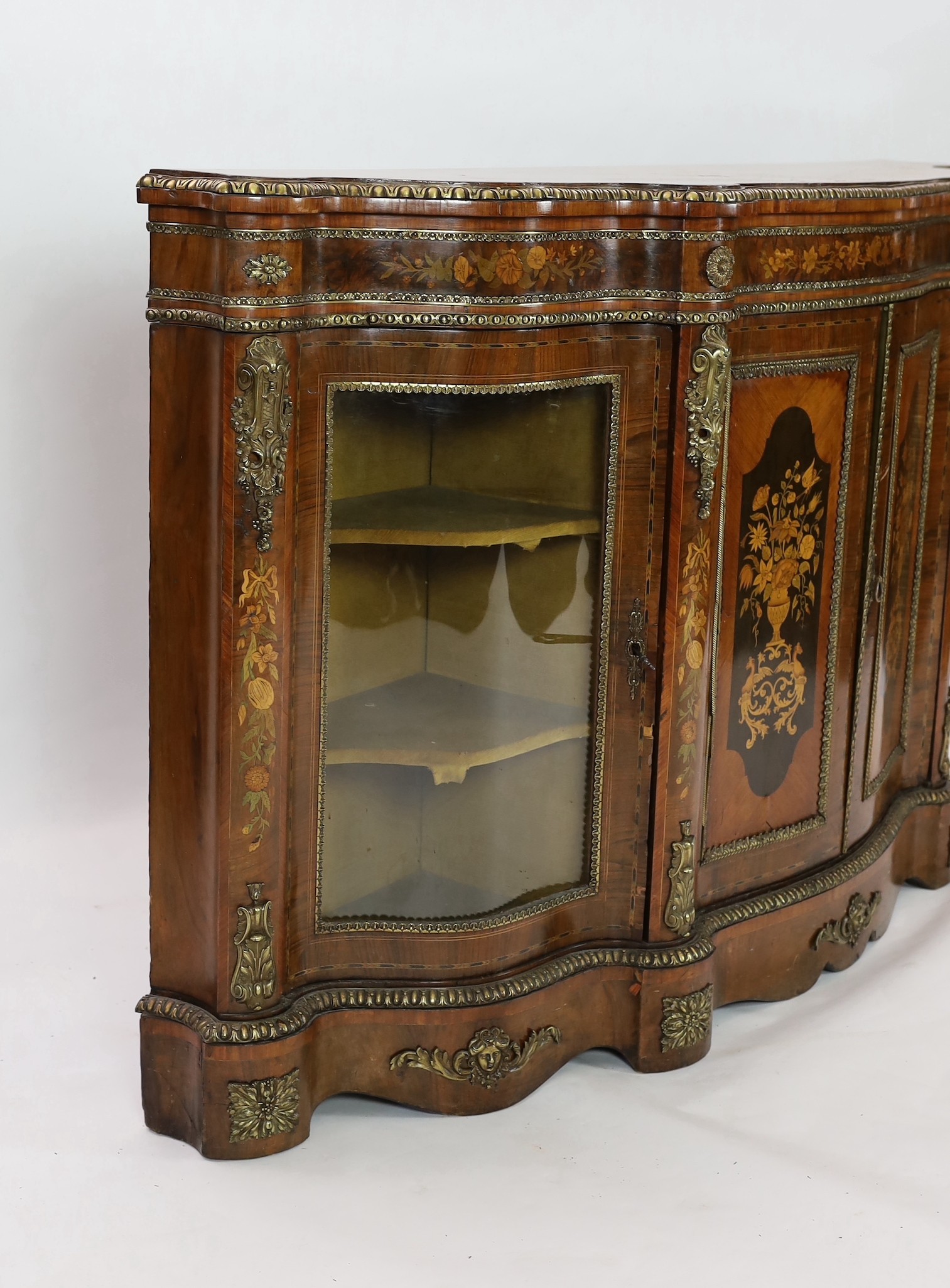 A Victorian marquetry inlaid walnut serpentine credenza, W.201cm D.48cm H.113.5cm